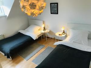 Postel nebo postele na pokoji v ubytování Ferien- und Messewohnung in Meerbusch + 4 fotografie