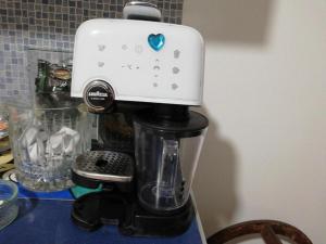 a black and white mixer sitting on top of a counter at A casa di marcello in Catanzaro