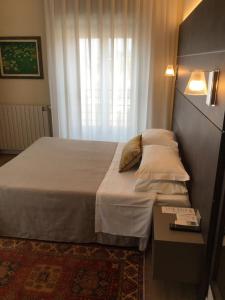 Postel nebo postele na pokoji v ubytování Hotel La Nuova Rotaia