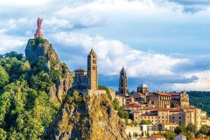 a city on top of a mountain with a town at STUDIO 1 personne dans le centre historique in Le Puy-en-Velay