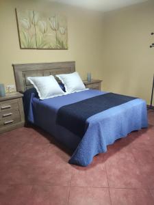 Postel nebo postele na pokoji v ubytování Apartamentos El Bosquexu