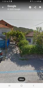 a picture of a driveway with a bunch of vines at House 23 A2 in Tivat