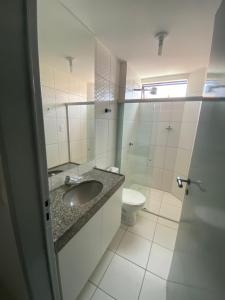 a bathroom with a sink and a toilet at Portal do Atlântico in Barra de São Miguel