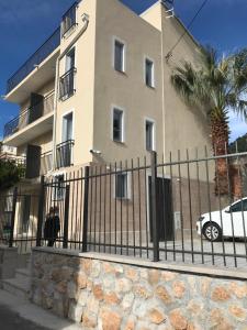 a white car parked in front of a building at Soheds in Budva