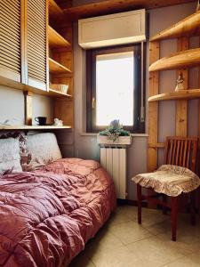 Кровать или кровати в номере La Maisonnette
