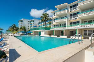 a swimming pool in front of a building at Rostrevor Hotel in Christ Church