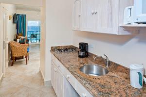 a kitchen with a sink and a counter top at Rostrevor Hotel in Christ Church