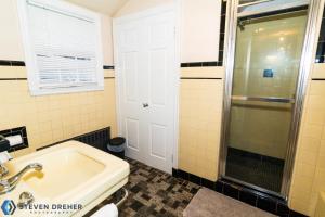 a bathroom with a sink and a shower at Town Plot Waterbury in Waterbury