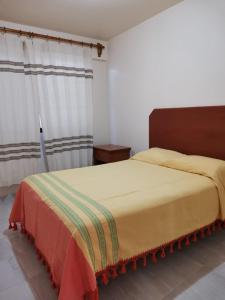 Tempat tidur dalam kamar di DEPARTAMENTOS OAXACA MÁGICO