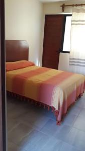 a bedroom with two beds in a room at DEPARTAMENTOS OAXACA MÁGICO in Oaxaca City