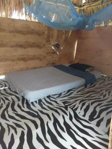 Letto o letti in una camera di Mida Creek Nature Camp