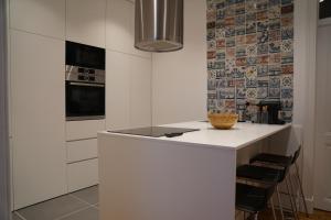 a kitchen with a white counter and a stove at Flora Baixa Apartments in Lisbon