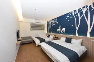 Ένα ή περισσότερα κρεβάτια σε δωμάτιο στο 巢棧The Nest Inn 包棟民宿