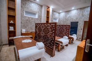 Postel nebo postele na pokoji v ubytování Bella Vita Hotel