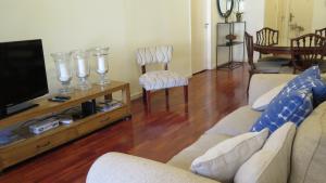 a living room with two couches and a flat screen tv at Fabulous and Quiet Apartment+Balcony in Barrio Norte. Your easy access to Buenos Aires! in Buenos Aires