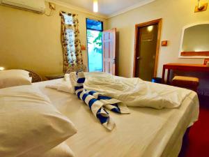 Voodi või voodid majutusasutuse Ocean Way Guraidhoo toas