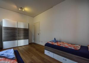 Кровать или кровати в номере · High-Quality in the heart of Stuttgart 3