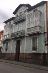 a building on the side of a street at Cantabria in Cabezón de la Sal