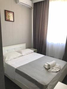 Postel nebo postele na pokoji v ubytování MEDELEAN HOTEL