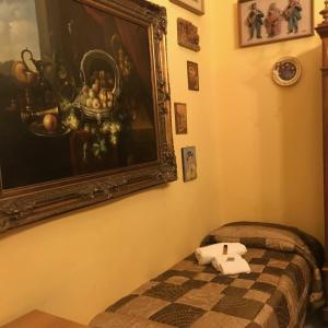 a bed with a picture of a cat on it at B&B Il Caravaggio in Catania