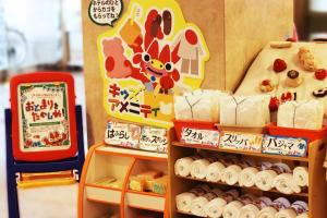 a toy store with sushi and a sign on the wall at Hotel Ocean (Kokusai-Dori) in Naha
