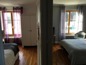 Postel nebo postele na pokoji v ubytování SUITE FAMILIALE DU BOURGEAU