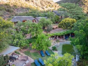 an aerial view of a resort with a swimming pool at De Poort Country Lodge in Oudtshoorn