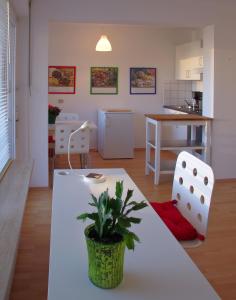 a living room with a white table and chairs at Apartment Bad Reichenhall in Bad Reichenhall