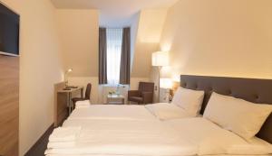 Ένα ή περισσότερα κρεβάτια σε δωμάτιο στο Hotel Prinz Albrecht