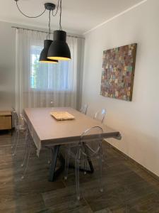 a dining room table and chairs in a room at casa Cuffa in San Vito lo Capo +31 photos