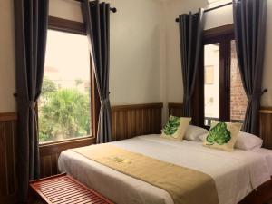 Giường trong phòng chung tại Tam Coc Marina villa