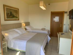 Postel nebo postele na pokoji v ubytování Hotel La Margherita & SPA