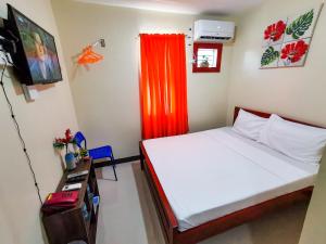 Postel nebo postele na pokoji v ubytování Downtown Suites