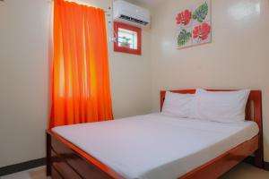 Postel nebo postele na pokoji v ubytování Downtown Suites