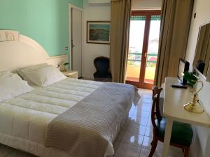 Postel nebo postele na pokoji v ubytování Hotel La Margherita & SPA