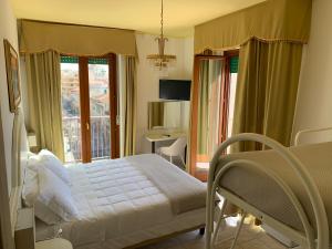 Postel nebo postele na pokoji v ubytování Hotel La Margherita & SPA