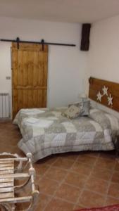 Postel nebo postele na pokoji v ubytování La Casetta Del Dahu