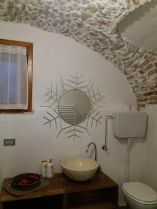 a bathroom with a sink and a mirror on the wall at La Casetta Del Dahu in Limone Piemonte