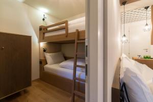 Voodi või voodid majutusasutuse Hotel Tofana toas