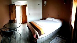 Cama o camas de una habitación en Hotel La Cochera