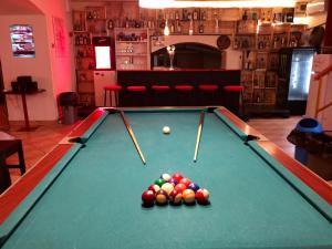 een pooltafel met ballen erop bij Whole basement former pub3 for bachelor / bachelorette party in Boedapest