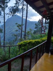 a balcony with a view of a mountain at Dream view in Ella