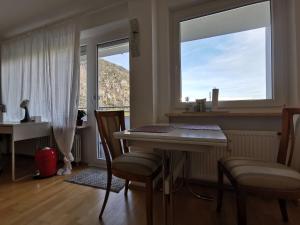 a dining room with a table and chairs and a window at Apartment Bad Reichenhall in Bad Reichenhall