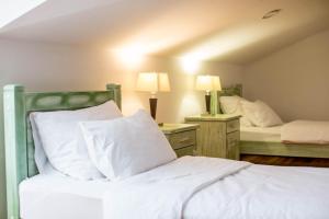 Voodi või voodid majutusasutuse Hotel Trim toas