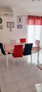 a dining room with a table and chairs at B&B Porta Nuova in Palermo