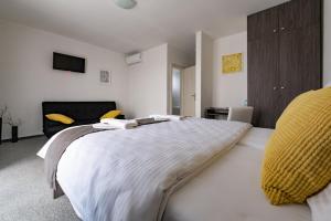 A bed or beds in a room at Penzión pod brezami**