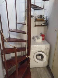 a laundry room with a washing machine and a washer at Center apartment Neno in Split