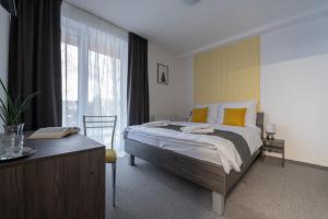 A bed or beds in a room at Penzión pod brezami**
