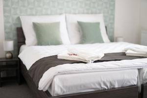 A bed or beds in a room at Penzión pod brezami**