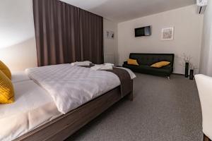 A bed or beds in a room at Penzión pod brezami**